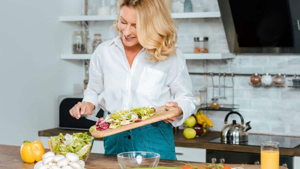 Woman Making Salad Food In The Kitchen
