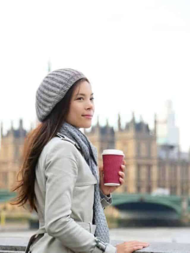 Tourist Woman Drinking Coffee By Westminster Bridge In London