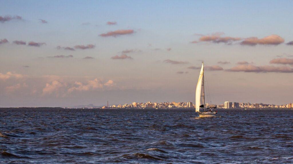 Boat In Guaiba Lake With Porto Alegre Brazil In The Background