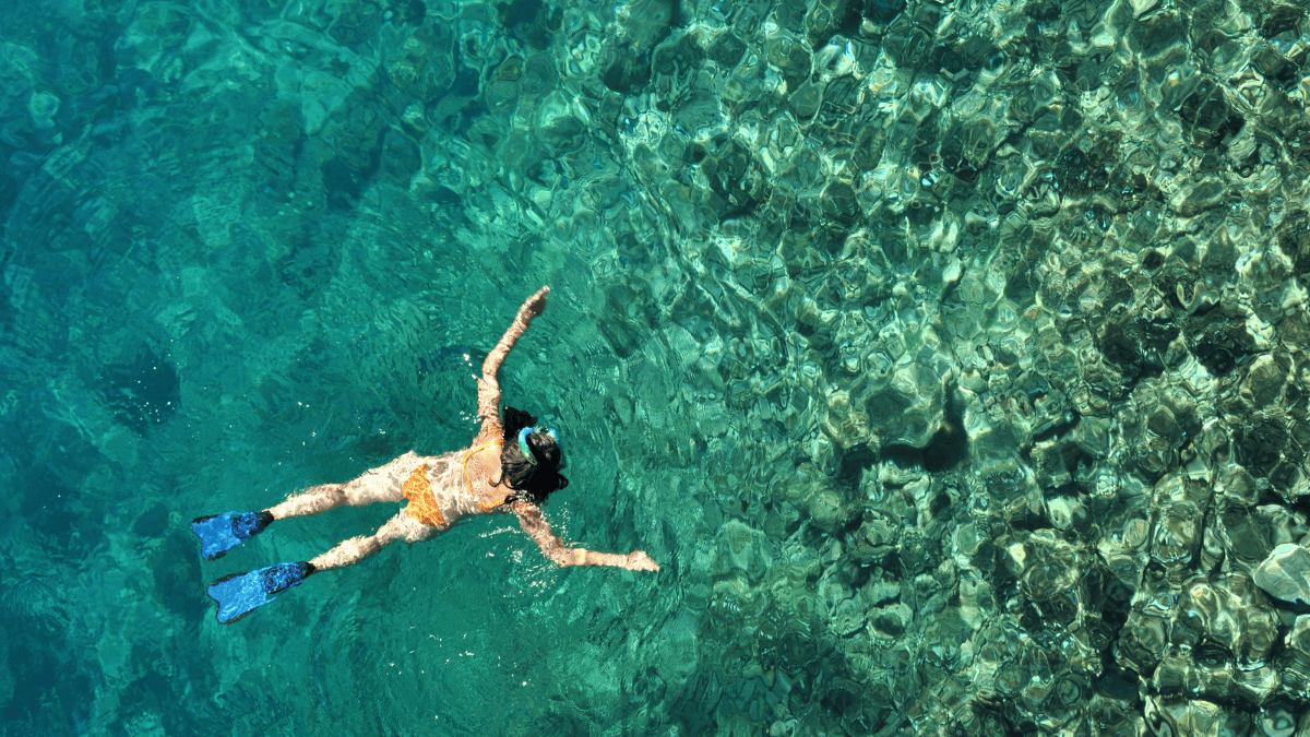 Woman Snorkeling in Crystal Clear Tropical Water in Phuket Thailand Stock