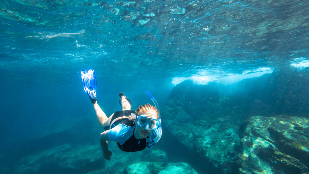 Female Swims in Deep Waters Stock