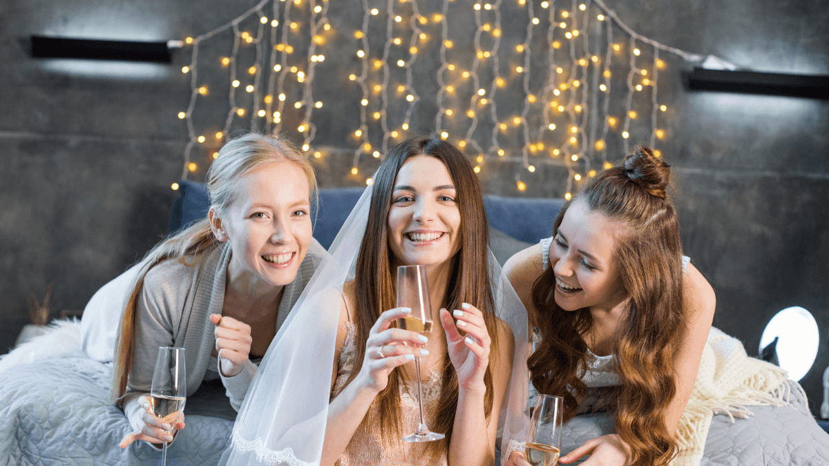 Young Women Drinking Champagne Stock