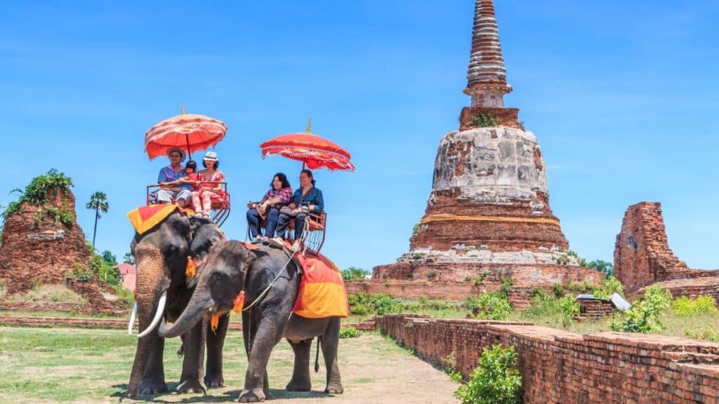 Tourists on an elephant ride tour Stock