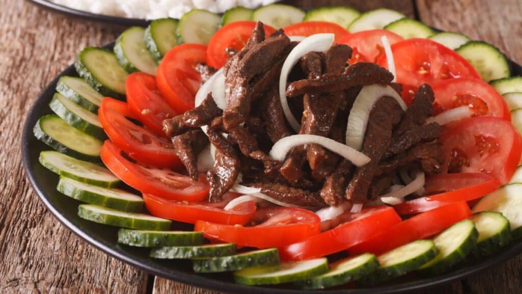 Cambodian beef Lok Lak with fresh vegetables Stock