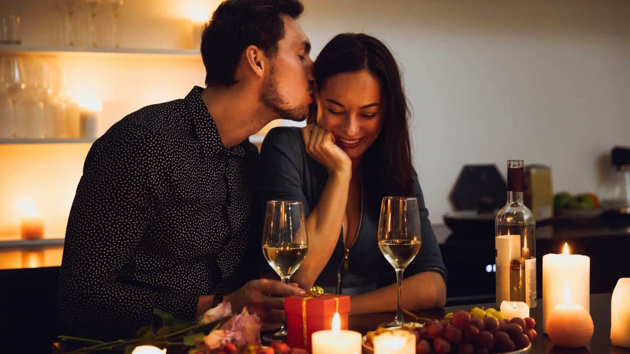 Beautiful passionate couple having a romantic dinner stock