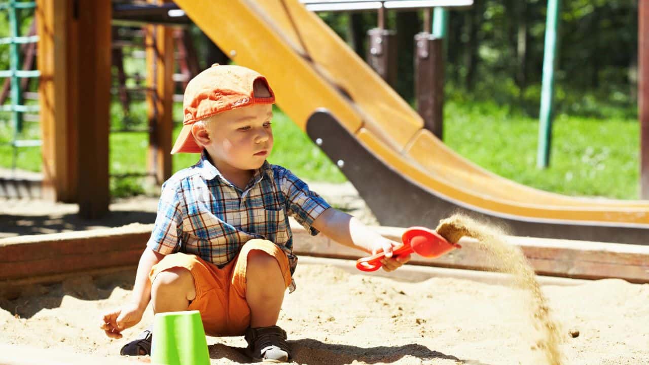 Child on playground stock