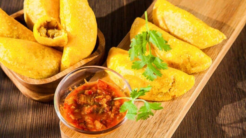 Colombian empanada with spicy sauce Stock