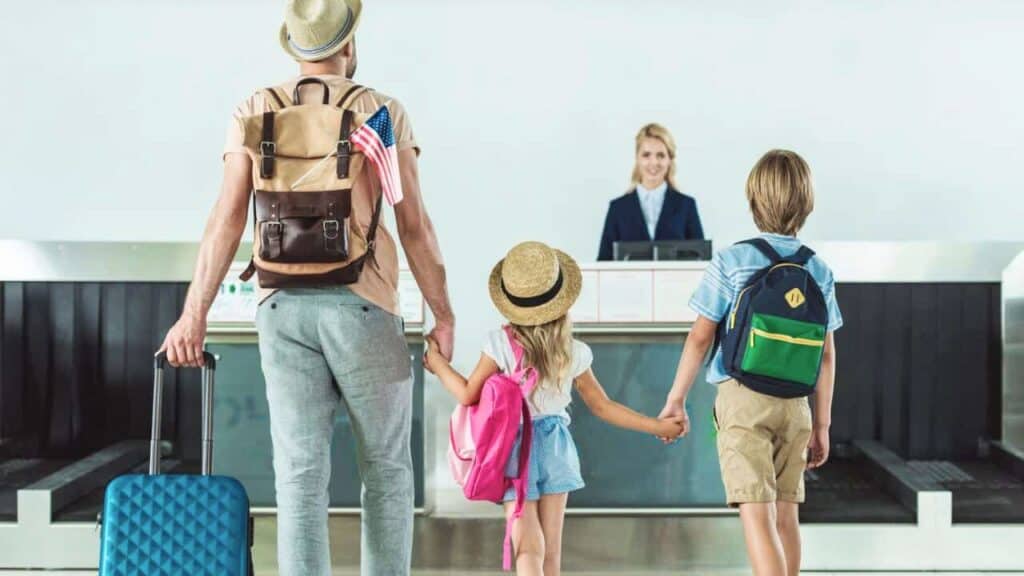 Family Going To An Airport Counter Desk Stock