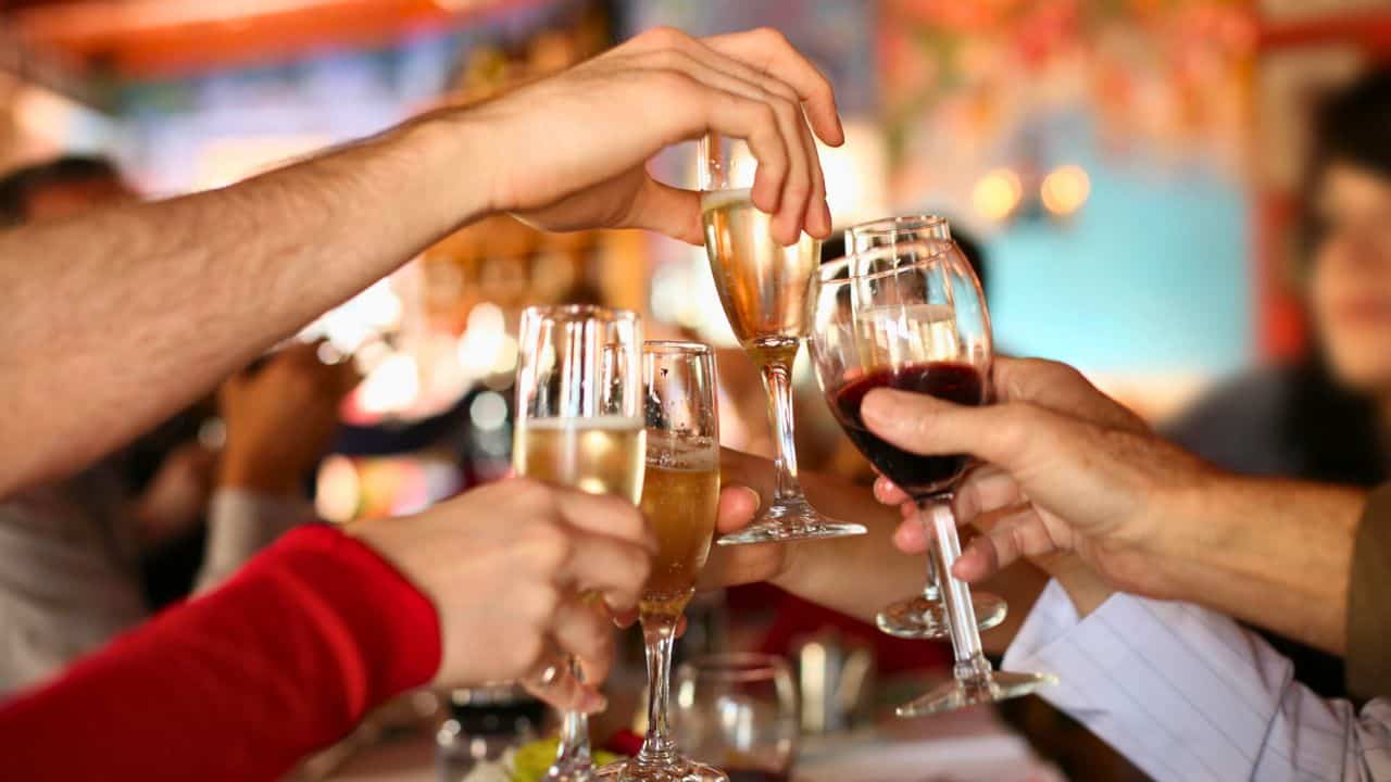 Hands holding the glasses of champagne stock