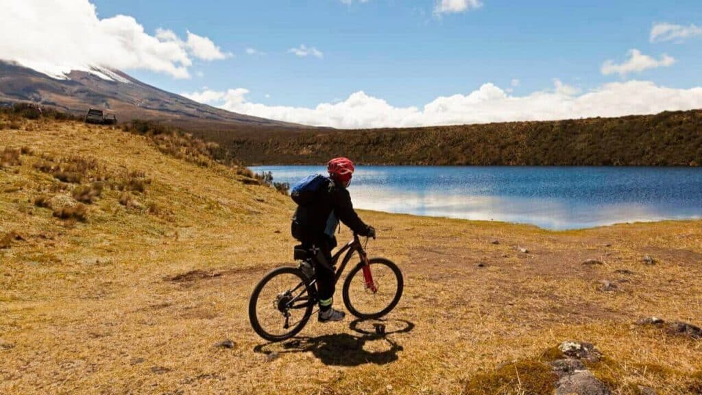 Tourist Biking In Cotopaxi Ecuador Stock