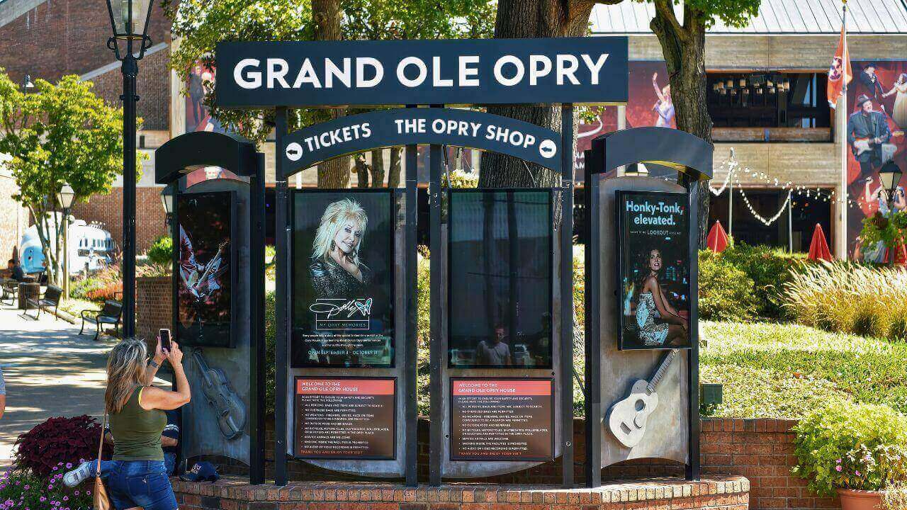 Tourists take pictures at entrance of The Grand Ole Opry House in Nashville TN Stock