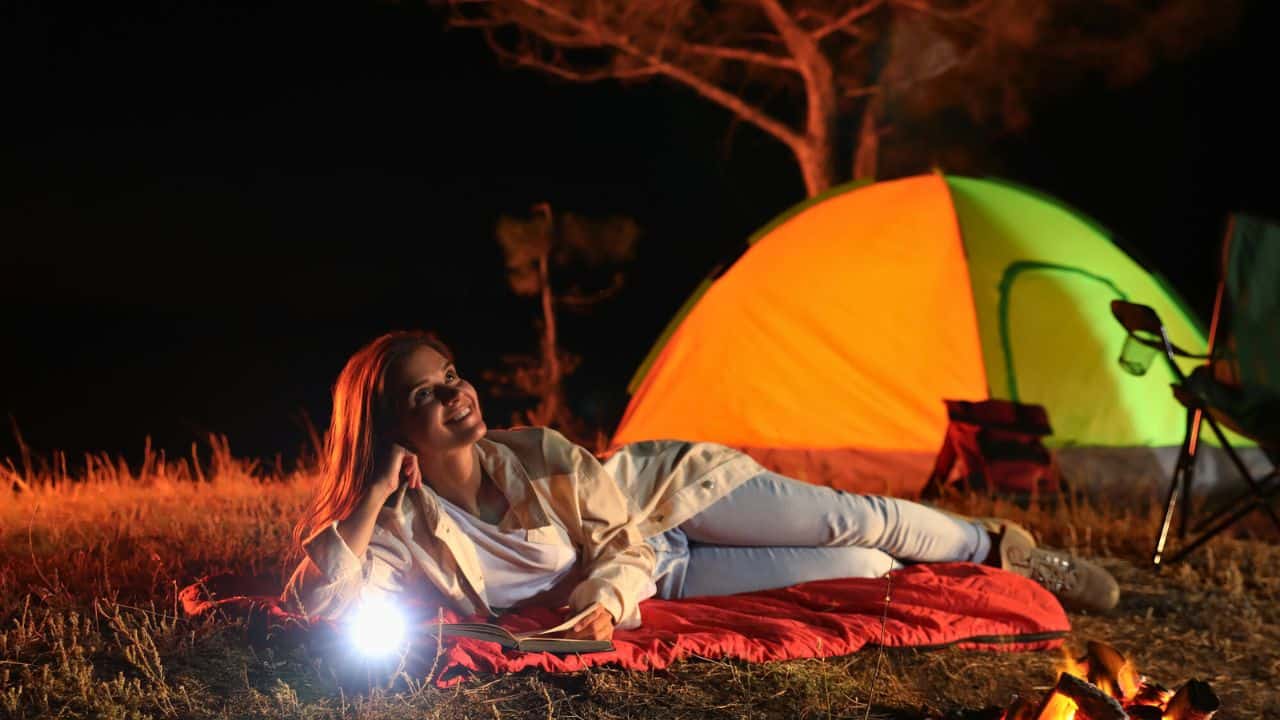 Young woman do camping Stock