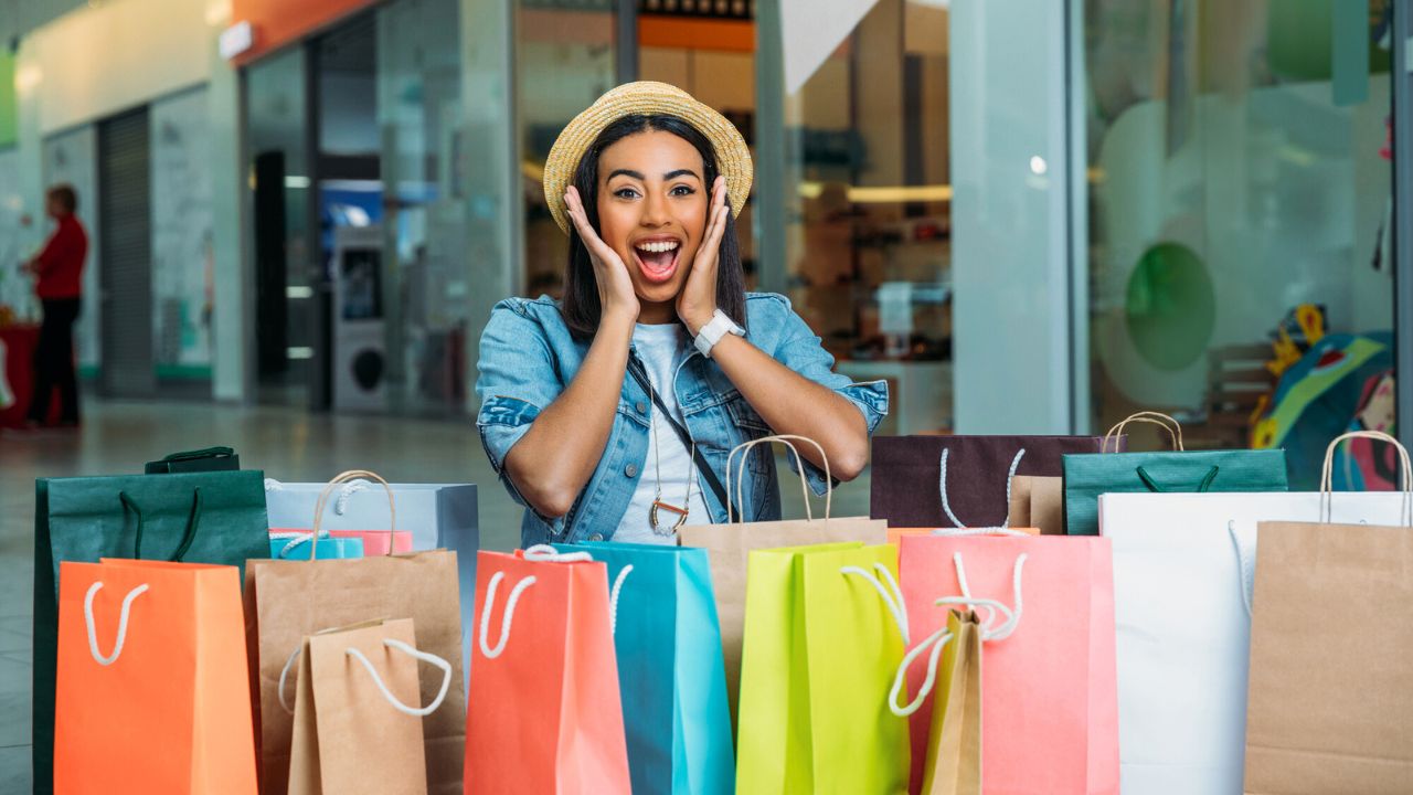 Young woman with shopping bags stock
