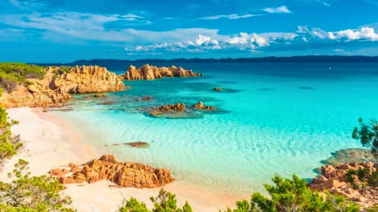 Pretty in Pink 14 Beautiful Pink Sand Beaches to Visit This Year Stock