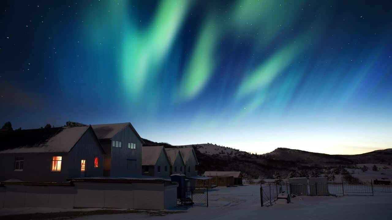Houses And Northern Lights Snowy Landscape Greenland