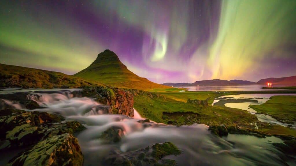 Northern light over Kirkjufell mountain in Iceland