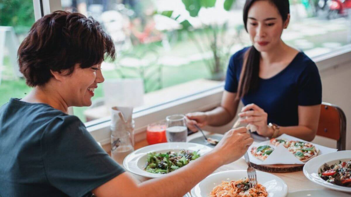 Two People Eating at the Restaurant Stock
