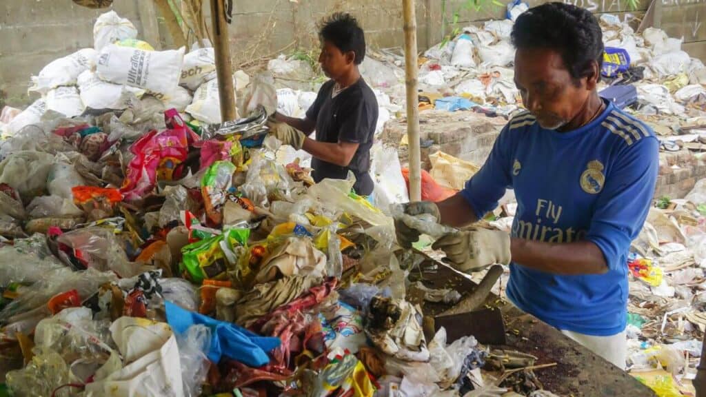 Workers segregating trash