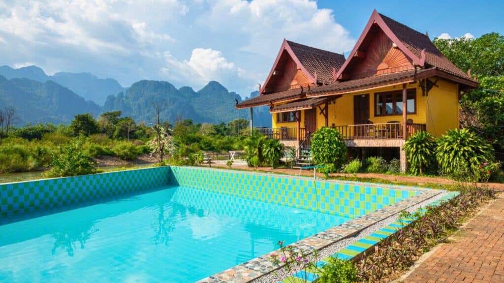Village and mountain in Vang Vieng, Laos and Nam Song rive , Lao — stock